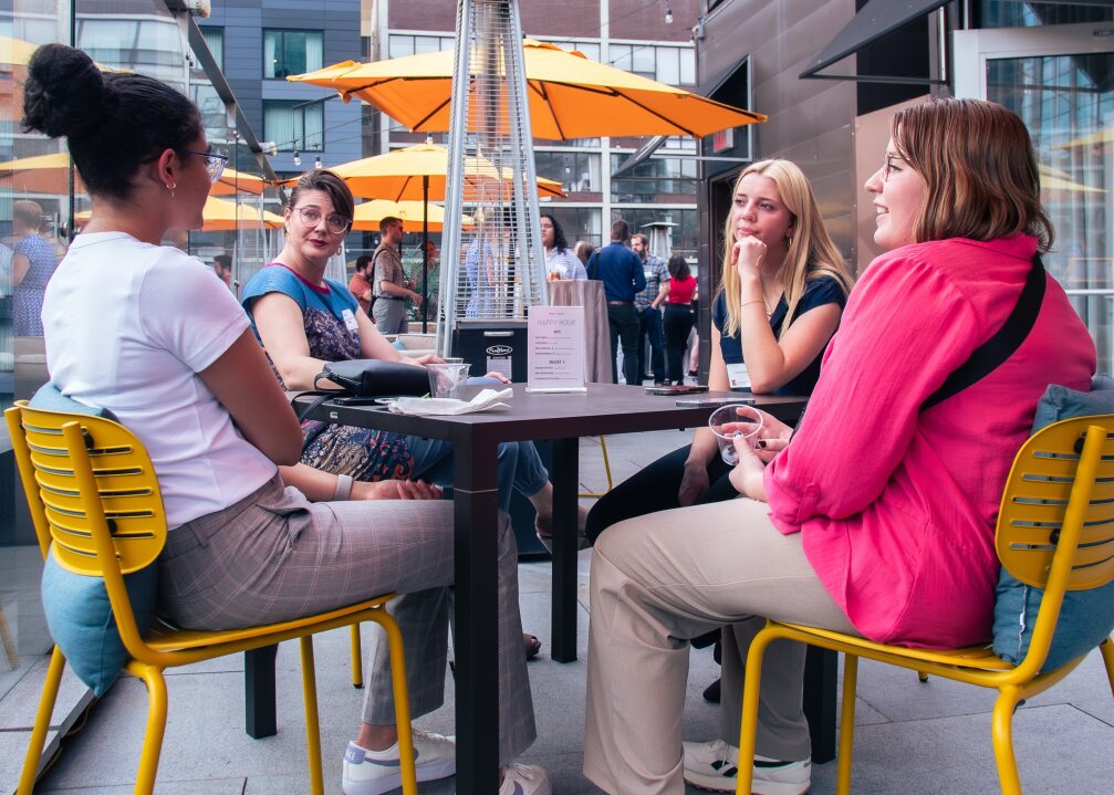 Students sitting at a table in Chicago, IL as part of the Chicago Externship Trek